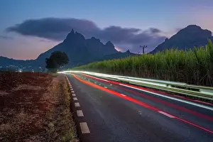 Light Trail Prints: View of trail lights and Long Mountains at dusk near Beau Bois