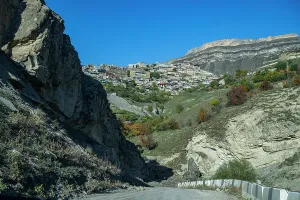 Traditions Prints: View of Tschoch village in Dagestan surrounded by rocky hills and clear blue sky during daylight hours