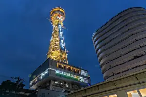 Bustling Prints: View of Tsutenkaku Tower and restaurants neon lights at dusk in the Shinsekai area