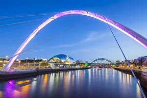 View of Tyne River and Gateshead Millennium Bridge at dusk, Newcastle-upon-Tyne, Tyne and Wear
