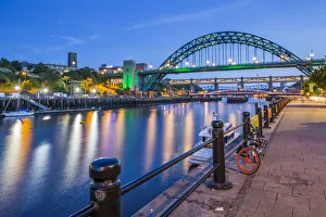 Bicycle Prints: View of Tyne River and Tyne Bridge at dusk, Newcastle-upon-Tyne, Tyne and Wear, England