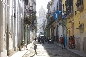 Children Prints: View along a typical residential street in Havana Vieja showing children playing