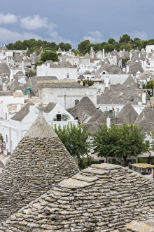 Trulli Prints: View of the typical Trulli built with dry stone with a conical roof, Alberobello