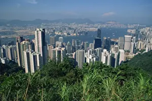 Victoria Peak Prints: View from Victoria Peak over the city skyline of Hong Kong Island to Kowloon in the distance