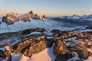 Senja Prints: View of the village of Husoy and icy sea along the Oyfjorden from peak Hesten at dawn