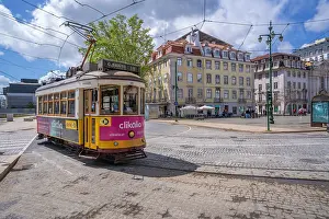 Streetscape Prints: View of a vintage tram in PC Duque da Terceira on a sunny day, Lisbon, Portugal, Europe