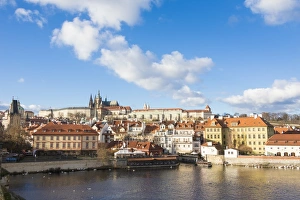 View of the Vltava River surrounded by the historical buildings, Prague, Czech Republic