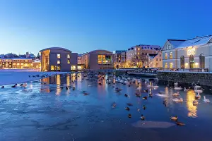 Nightfall Prints: View of waterfront buildings and City Hall in background in the city centre of Reykjavik at dusk in winter
