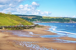 Huts Prints: View over Whitby Sands (West Cliff) beach