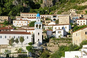 Terracotta Prints: View of whitewashed buildings on mountainside, village of Dhermi, Albania, Europe