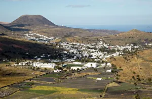 Volcanic Cone Prints: View over whitewashed houses to Monte Corona volcano cone