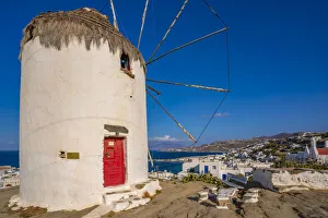 Windmills Prints: View of whitewashed windmill overlooking town, Mykonos Town, Mykonos, Cyclades Islands