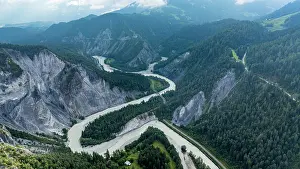 Altitude Prints: View of the winding river in Rhein gorge showcasing the natural beauty of Switzerland with mountains in the background