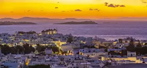 Windmills Prints: View of windmills and Aegean Sea from elevated position at sunset, Mykonos Town, Mykonos