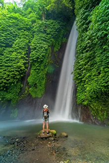 Pure Prints: View of woman taking picture at Melanting waterfall