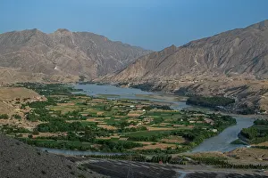 Kabul Prints: Viewpoint looking over the Kabul river near Jalalabad with hills and fields at sunset in Afghanistan