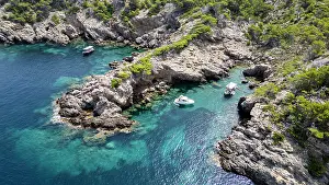 Cruise Prints: Views of the Alcudia peninsula showcasing rocky shores and clear turquoise waters in Mallorca