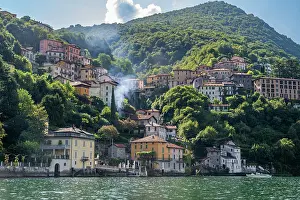 Homes Prints: Views of colorful buildings on the hillside overlooking Lake Como in Nesso