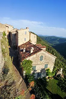 Southern Prints: Views of hillside buildings in a small village in southeast France surrounded by mountains