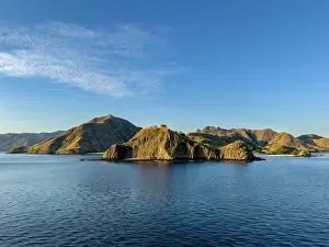 West Prints: Views of Komodo Island with hills and water on a clear day in Indonesia near West Manggarai Regency