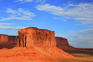 Indigenous Prints: Views of rock formations in Monument Valley with blue sky and clouds in Navajo Indian Territory Utah USA
