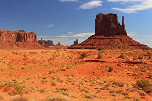 Tribal Prints: Views of rock formations in Monument Valley with blue sky and desert landscape in Utah