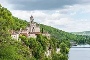 Southwest Prints: Village of Albas overlooking Lot River with buildings and green hills in Midi-Pyrenees