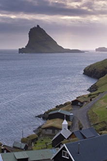 Images Dated 11th September 2008: Village of Bour and Tindholmur island rising to 262m, at sunset from Vagar