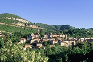 Aveyron Prints: Village of Creissels with green hills and clear blue sky in Aveyron region of France