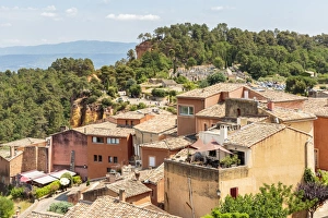 Provence Alpes Cote Dazur Prints: Village houses and the entrance of the Ochre trail in the background, Roussillon