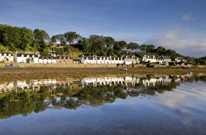 Images Dated 12th September 2009: Village of Plockton bathed in early morning light and reflecting in calm sea at low tide