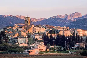 Vaucluse Prints: Village of Sablet with mountain backdrop during sunset in Provence, southeastern France