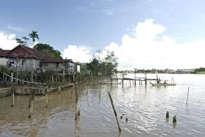 Village of stilted houses on the banks of the Rejang River, Sarakei district