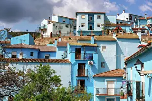 House Exterior Prints: Village street in blue painted Smurf house village of Juzcar