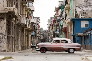 Vintage Car Prints: A vintage American car driving across a street in Havana, Cuba, West Indies, Caribbean
