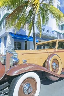 Vintage car by art deco building, Ocean Drive, Art Deco District, South Beach