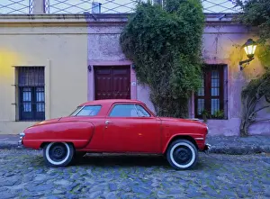 Rural Roads Prints: Vintage Studebaker car on a cobblestone lane of the historic quarter