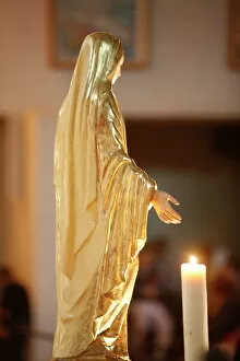 Virgin Mary and candle in Ars basilica, Ars-sur-Formans, Ain, France, Europe