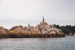 Worship Prints: Virgin Mary statue on tidal rock in Brittany symbolizing maritime devotion in a local landmark