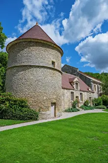 Towers Prints: Visit to the Abbey of Fontenay in France showcasing its stone architecture and green surroundings on a sunny day