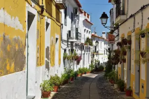 Quaint Prints: Visit to the historic streets of Moura in the Alentejo region of Portugal during a bright day in southwestern Europe