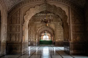 Mughal Prints: Visit to the interior hall of Badshahi Mosque showing art and architecture during midday in Lahore
