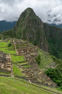 Terraces Prints: Visit to Machu Picchu showing ancient stone structures and green terraces in the Andes mountains of Peru
