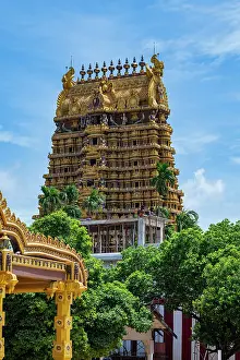 Rituals Prints: Visit to Nallur Kandaswamy Devasthanam Hindu temple in Sri Lanka with bright sky and lush trees around