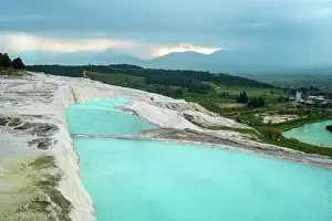 Terraces Prints: Visit Pamukkale with white travertines and turquoise pools on a cloudy day in Turkey