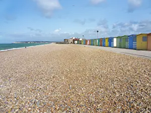 Huts Prints: Visit to Shingle Beach with colorful beach huts in Seaford East Sussex during sunny weather in the United Kingdom