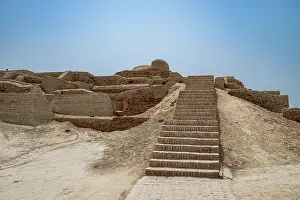 Settlement Prints: Visiting the ancient site of Moenjodaro shows the steps leading up to historic structures in a dry landscape