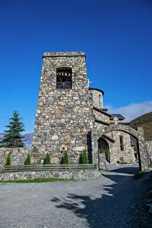 Visitors Prints: Visitors admire detailed stone architecture at Alanskiy Svyato-Uspenskiy Muzhskoy Monastry in North Ossetia during
