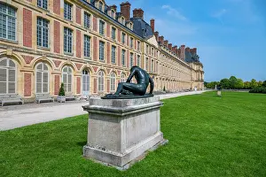 Bronze Prints: Visitors admire the sculpture in the garden of Fontainebleau palace during a sunny day in France