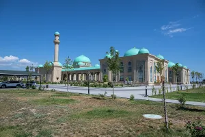 Domes Prints: Visitors admire the unique architecture of Haydar Mosque with turquoise domes